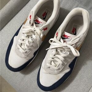 Nike Men's White and Navy Sneakers with Gold Accents